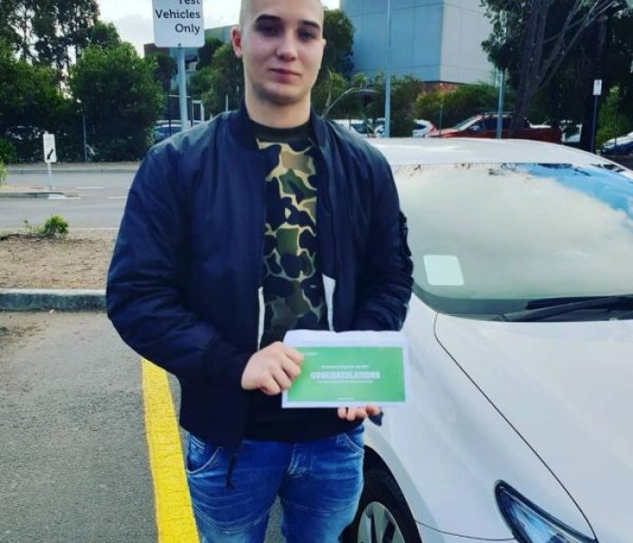Alex with his Probationary Licence after the Driving Test.